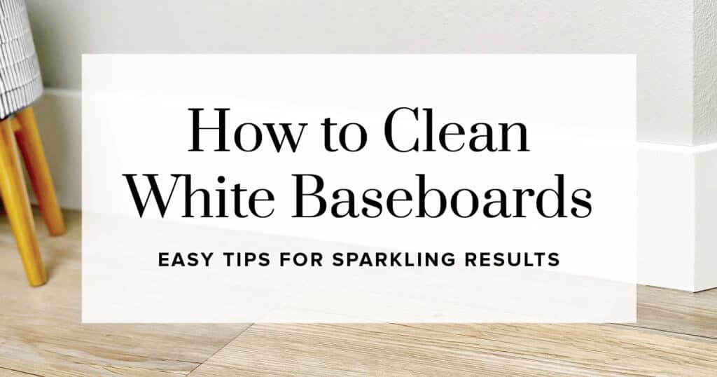 White Baseboards with Grey Walls and Wood Flooring with Text Overlay 'How to Clean White Baseboards'